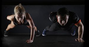 two people doing pushup, get content marketing fit